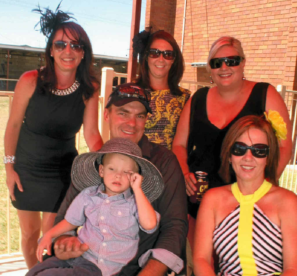 Linda Roderick, Jenny Miles, Railway Hotel publican Robyn Miles, Paul and Logan Roderick and Peta Bell dress up for a day at the races.